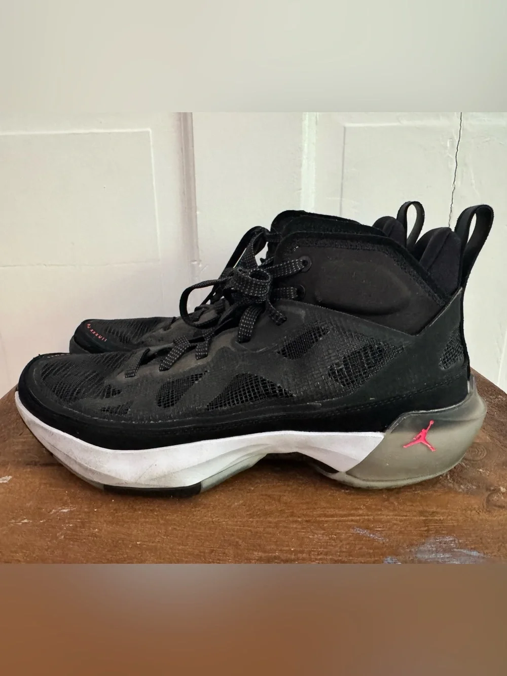 Boy’s Nike Air Jordan XXXVII Black Hot Punch basketball shoes.